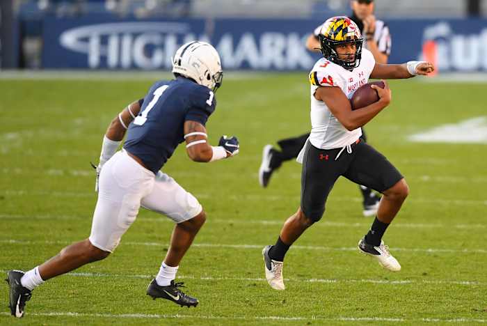 Taulia Tagovailoa runs away from a Penn State defender.